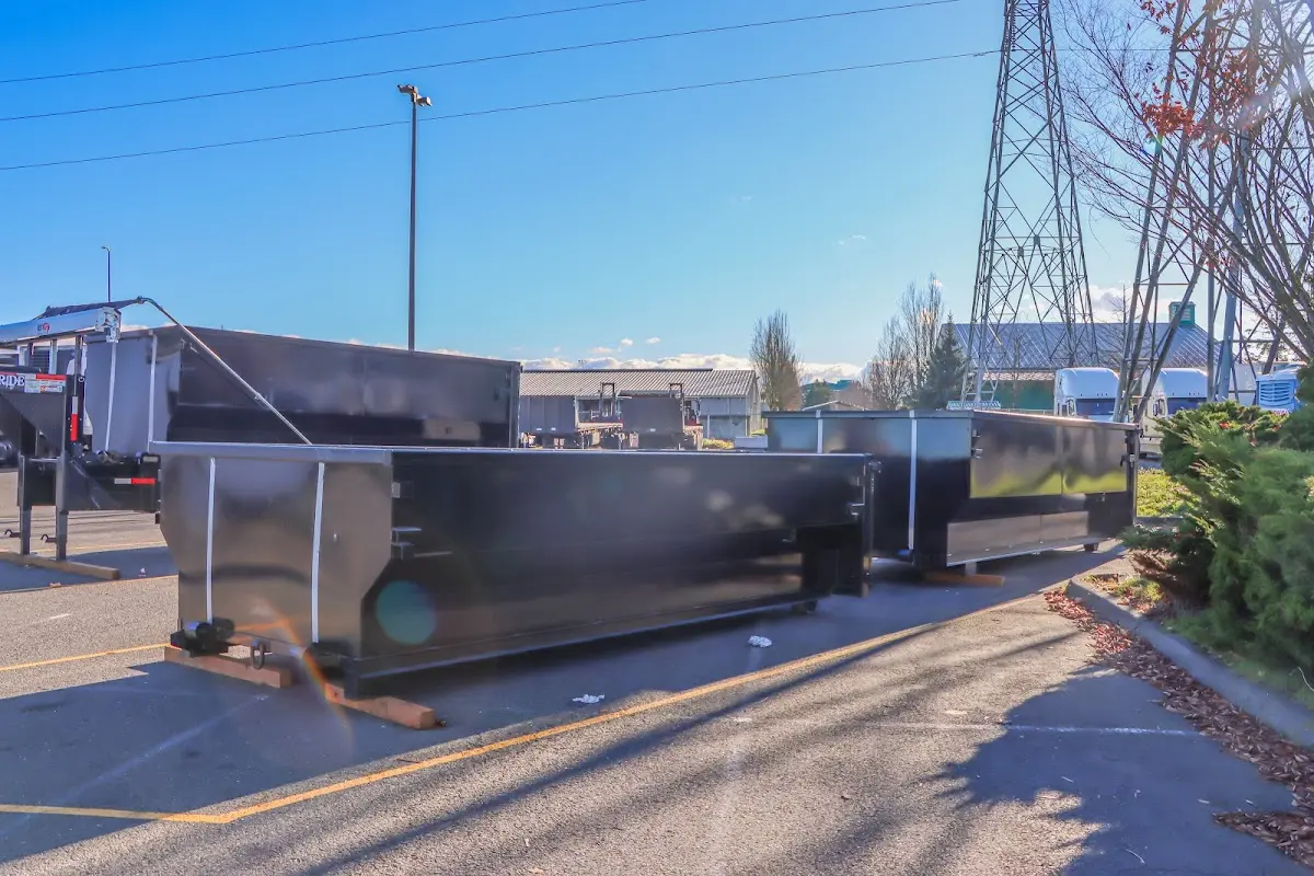 Roll-off dumpster ready for waste disposal at job site for 15 Yard Dumpster Rental in Luling